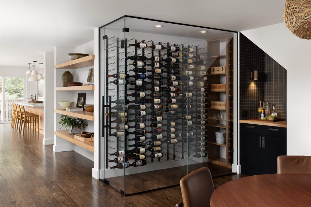 Interior of home with glass-enclosed wine storage, bar, built-in shelves