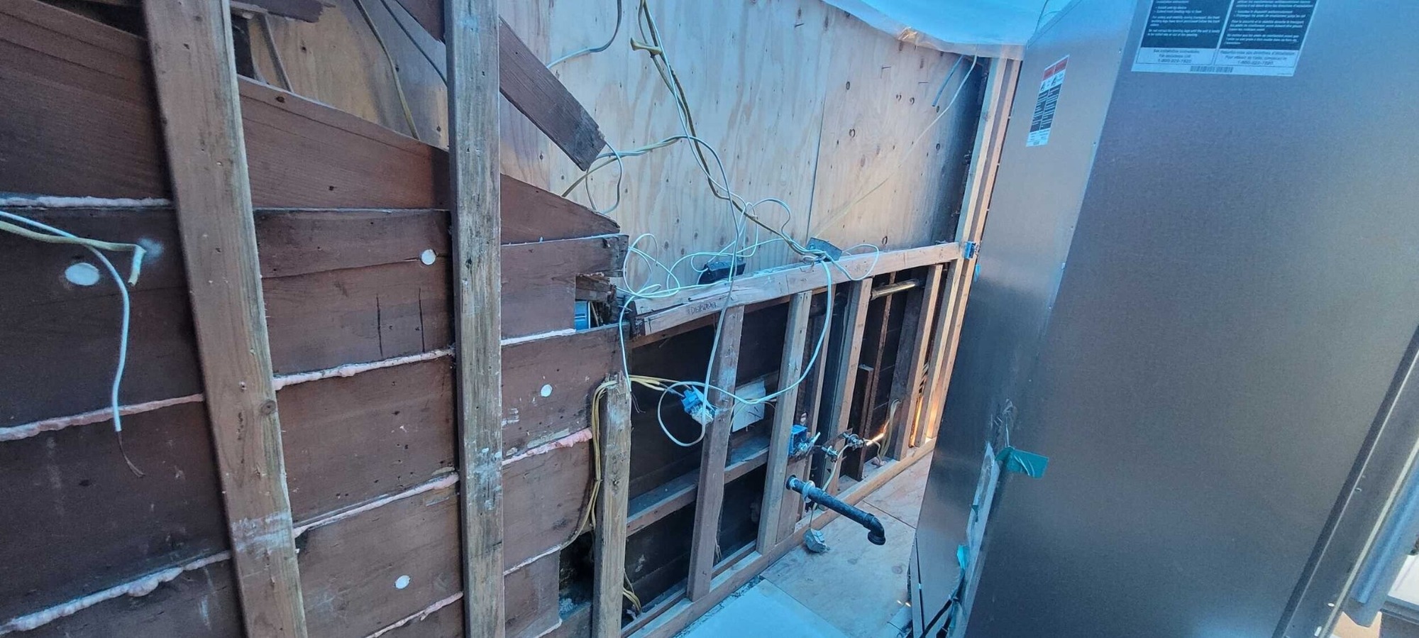 exposed wall framing after tree damage before whole home remodeling by js design and build in napa ca